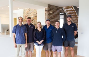 A team photo showing six of The Peninsula Homes team members